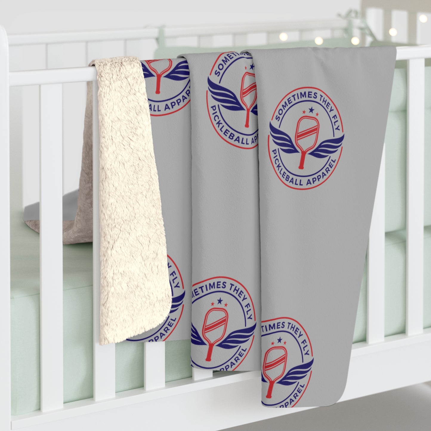 Sometimes they fly cozy Sherpa blanket over a baby’s cradle