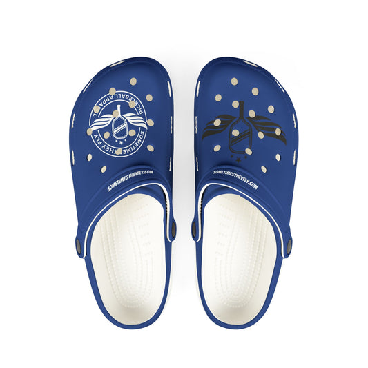 Sometimes They Fly Pair of blue clogs with white soles on a white background